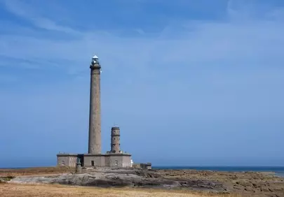 Majestic Normandy Lighthouse: Coastal Grandeur Under Azure Skies