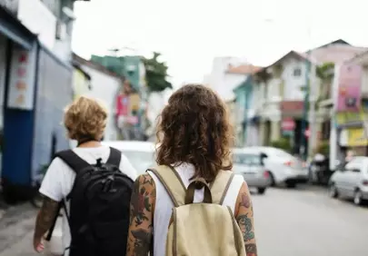 Wanderlust Unleashed: Backpackers Exploring Historic Streets