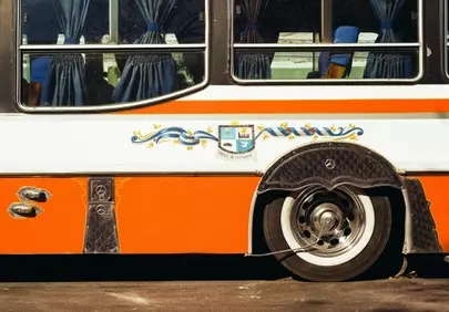 Vibrant Vintage Charm: Orange Accents on a Classic Bus
