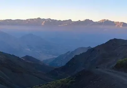 Breathtaking Mountain Dawn: Serene Peaks and Misty Valleys