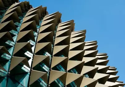 Striking Modern Architecture: Geometric Facade Against Blue Sky