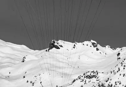 Adrenaline-Fueled Alpine Flight: Paragliding Over Snowy Peaks