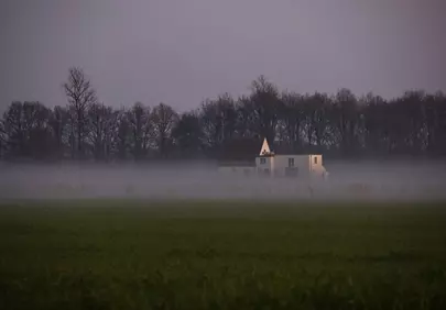Mystical Twilight: Secluded Farmhouse in Autumnal Fog
