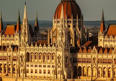 Golden Sunset Bathes Budapest Parliament in Historic Grandeur
