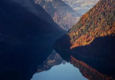 Breathtaking Autumn Sunset Reflection on Klöntalersee, Switzerland