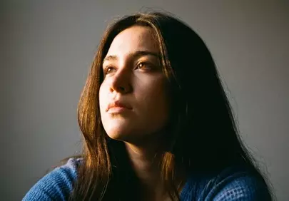 Stunning Natural Beauty: Contemplative Woman in Soft Light
