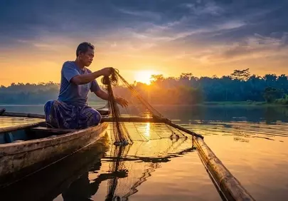 Golden Hour Angler: Traditional Fishing at Sunset