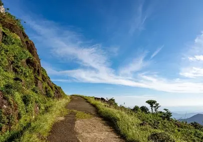 Breathtaking Mountain Path: Serene Hike Under Azure Skies