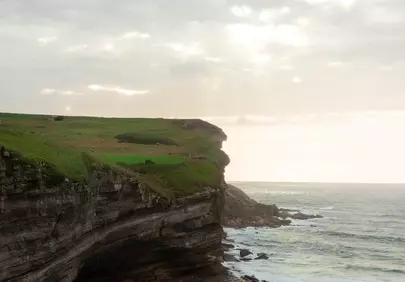 Dramatic Coastal Cliffs: Nature's Raw Beauty at Sunrise