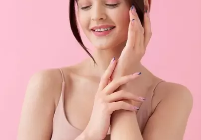 Radiant Serenity: Woman's Peaceful Smile on Pink Background