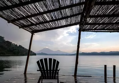 Serene Lake Sunset: Perfect Retreat Amidst Majestic Mountains