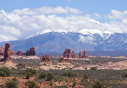 Majestic Utah Landscape: Red Rocks and Snow-Capped Peaks