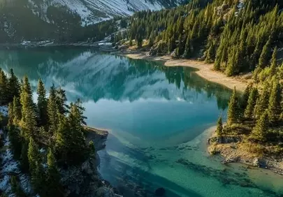 Stunning Winter Panorama: Pristine Mountain Lake Reflection