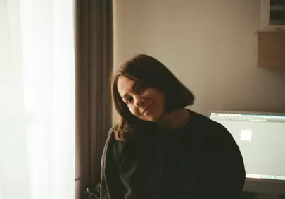 Radiant Charm: Gentle Smile of a Young Woman