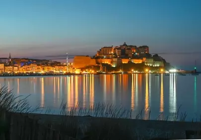 Enchanting Calvi Citadel: Evening Glow over Corsica Harbor