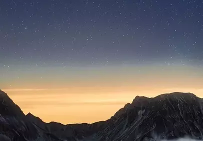 Celestial Spectacle: Comet Lemmon Graces Japan's Alps at Sunset