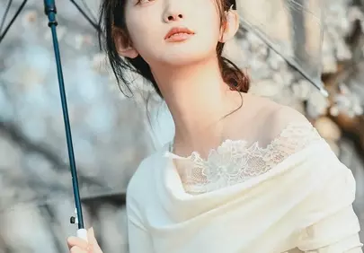 Enchanting Spring Blossom Portrait: Woman with Umbrella and Book