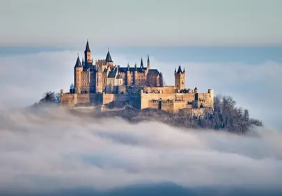 Majestic Hohenzollern Castle Rises from Misty Dawn