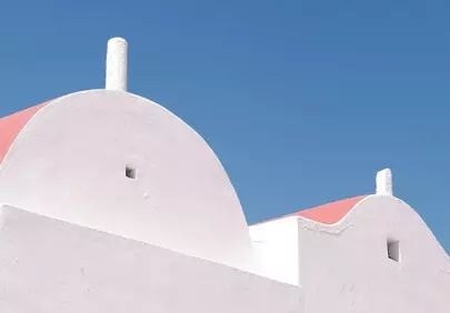 Minimalist Aegean Charm: White Architecture Under Azure Skies