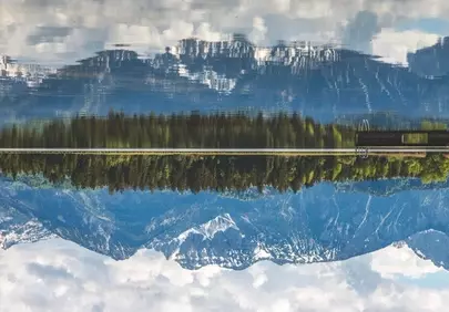 Stunning Alpine Lake Mirroring Sky and Peaks