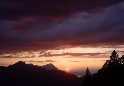 Dramatic Alpine Sunset: Fiery Skyscape Over Stoos Mountains