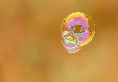 Enchanting Iridescent Soap Bubbles on Warm Background