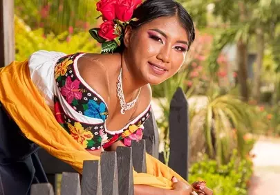 Vibrant Springtime: Mexican Woman's Radiant Smile in Traditional Attire