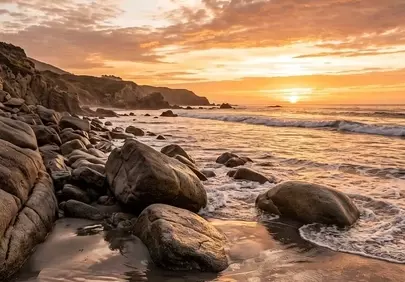Breathtaking Coastal Sunset: Golden Hues Over Rocky Beach