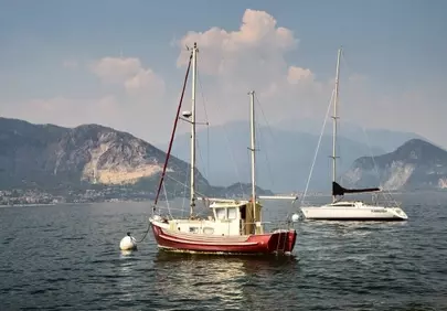 Serene Lake Maggiore: Yachts & Mountains Under a Sunny Sky