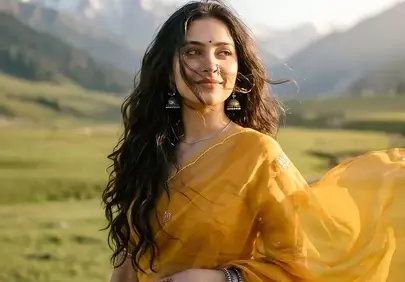 Stunning Indian Beauty in Sari Amidst Majestic Mountains
