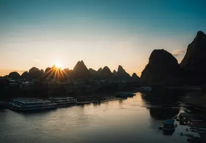 Breathtaking Karst Sunrise over Serene River Landscape