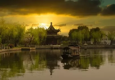 Breathtaking Sunset over Ancient Chinese Pavilion and Serene Lake
