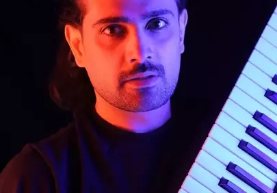 Vibrant Keyboardist Portrait: Dramatic Lighting and Musical Passion