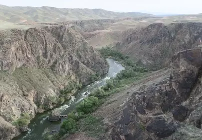 Breathtaking Kazakhstan Canyon: River Serenity Amidst Rugged Peaks