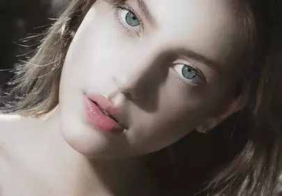 Captivating Gaze: Radiant Retro Beauty with Big Blue Eyes