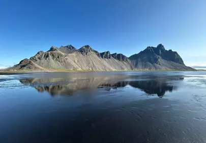 Dramatic Vestrahorn Peaks Reflected on Iceland's Black Sand Beach