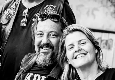 Joyful Group Portrait: Bikers and Friends Smiling Brightly
