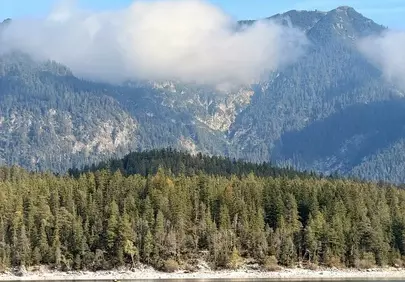 Serene Mountain Lake Reflecting Autumn's Majesty