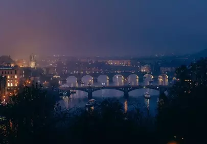 Prague's Enchanting Night: Bridges Aglow Over Vltava