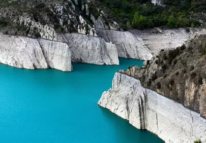 Stunning Azure Lake Nestled Amidst Dramatic Limestone Cliffs