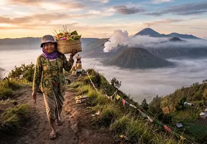 Mystical Indonesian Sunrise: Offerings Amidst Volcanic Grandeur