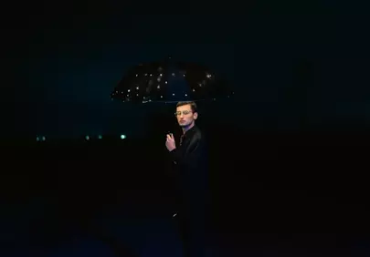 Enigmatic Night: Dapper Man with a Starry Umbrella in 4K