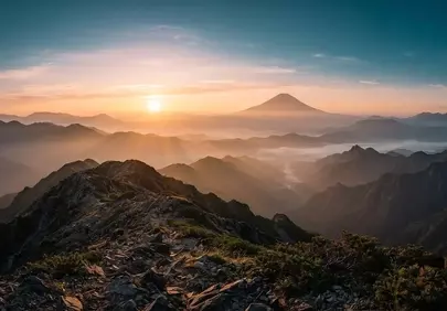 Majestic Volcanic Sunrise: Golden Peaks and Misty Valleys