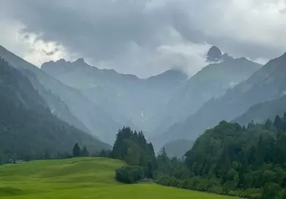 Dramatic Mountain Majesty: Misty Peaks and Verdant Valleys