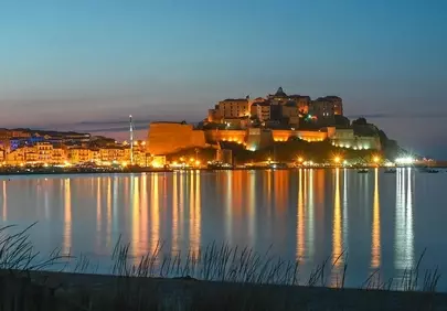 Enchanting Calvi Citadel: Illuminated Harbor at Twilight
