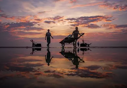Stunning Dawn: Fishermen Reflected on Vietnam's Beach