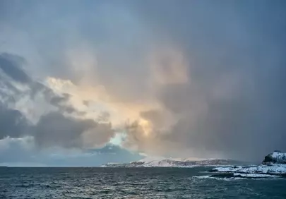 Dramatic Winter Sunrise over the Norwegian Fjord