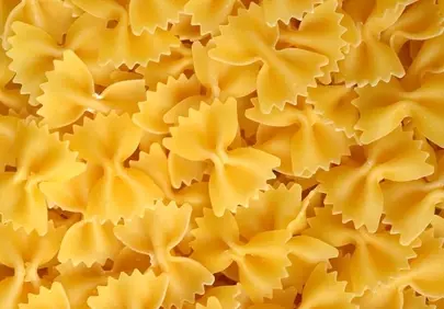 Vibrant Farfalle: A Delightful Uncooked Pasta Background
