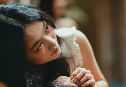 Serene Beauty: Thoughtful Woman's Peaceful Gaze
