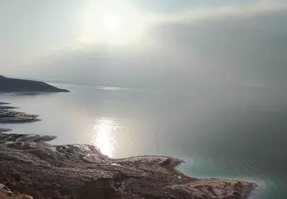 Breathtaking Coastal Sunrise: A Serene Morning on the Rocky Shore